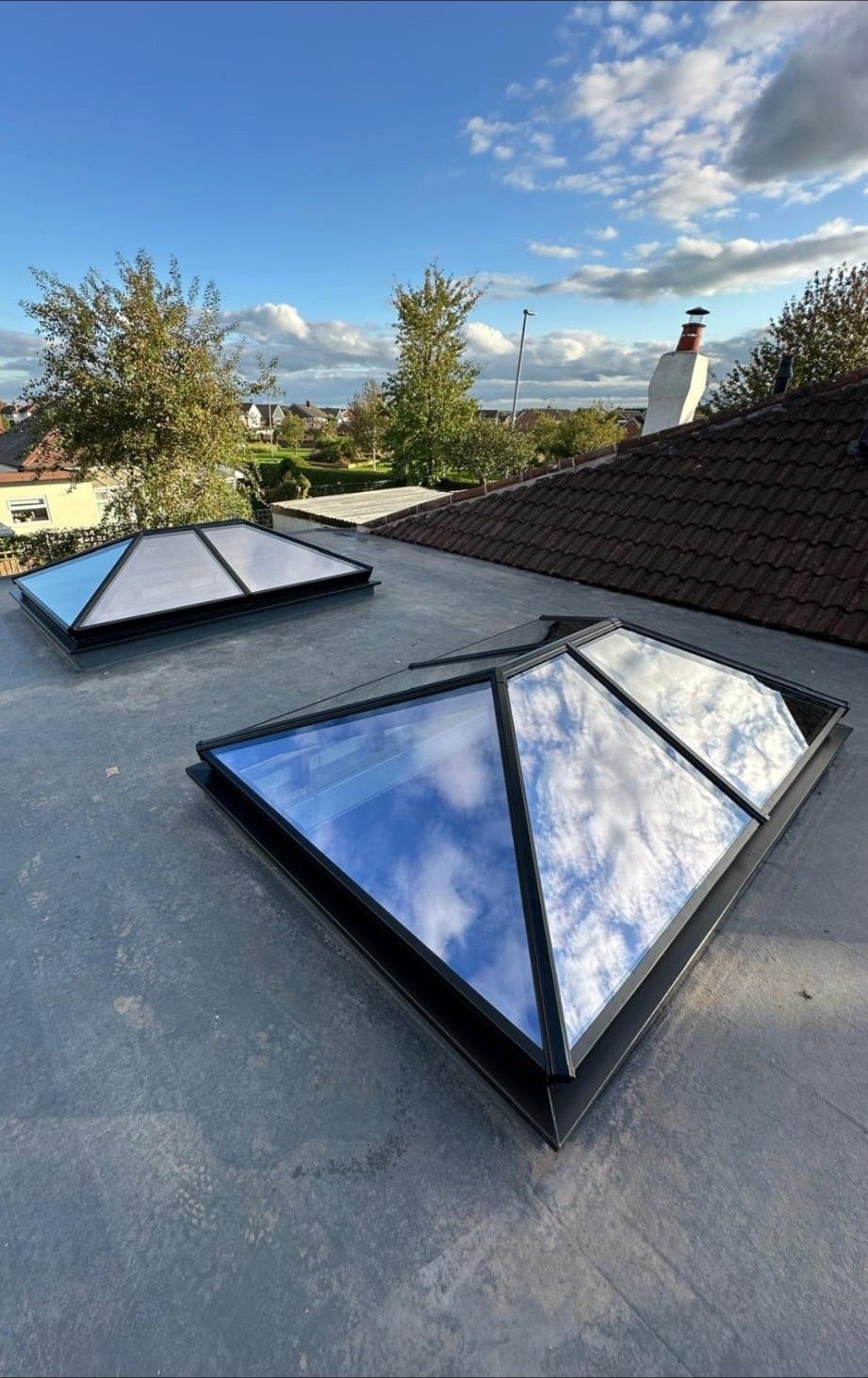 Twin roof lanterns on a flat roof
